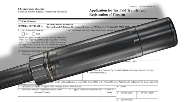 A close-up shot of a black metallic firearm suppressor placed diagonally over an official U.S. Department of Justice document. The paperwork is titled "Application for Tax Paid Transfer and Registration of Firearm" (ATF Form 4), highlighting the legal registration process for firearm accessories.